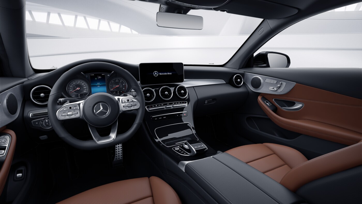Poste de conduite de la Mercedes Classe C Coupé Finition AMG Line avec vue sur l’écran tactile, sellerie et la console centrale - couleur marron