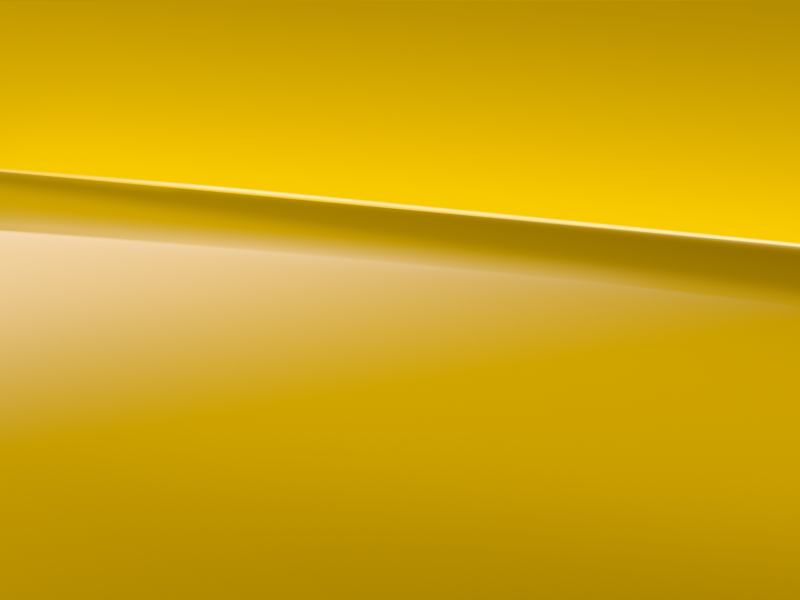 Vue de trois quarts de profil de la Mercedes CLA avec la peinture Standard jaune soleil