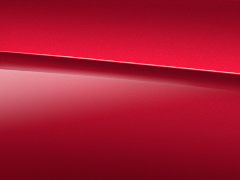Vue de trois quarts de profil de la Mercedes CLA avec la peinture designo - rouge Patagonie métallisé