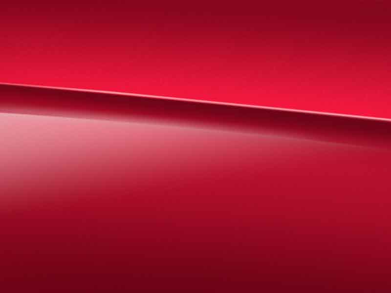 Vue de trois quarts de profil de la Mercedes-Benz GLA avec une peinture designo - rouge Patagonie Métallisé 
