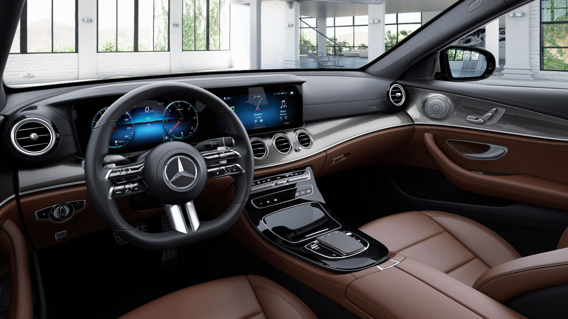 Poste de conduite de la Mercedes Classe E Berline AMG Line avec vue sur l’écran tactile, la console centrale et sellerie