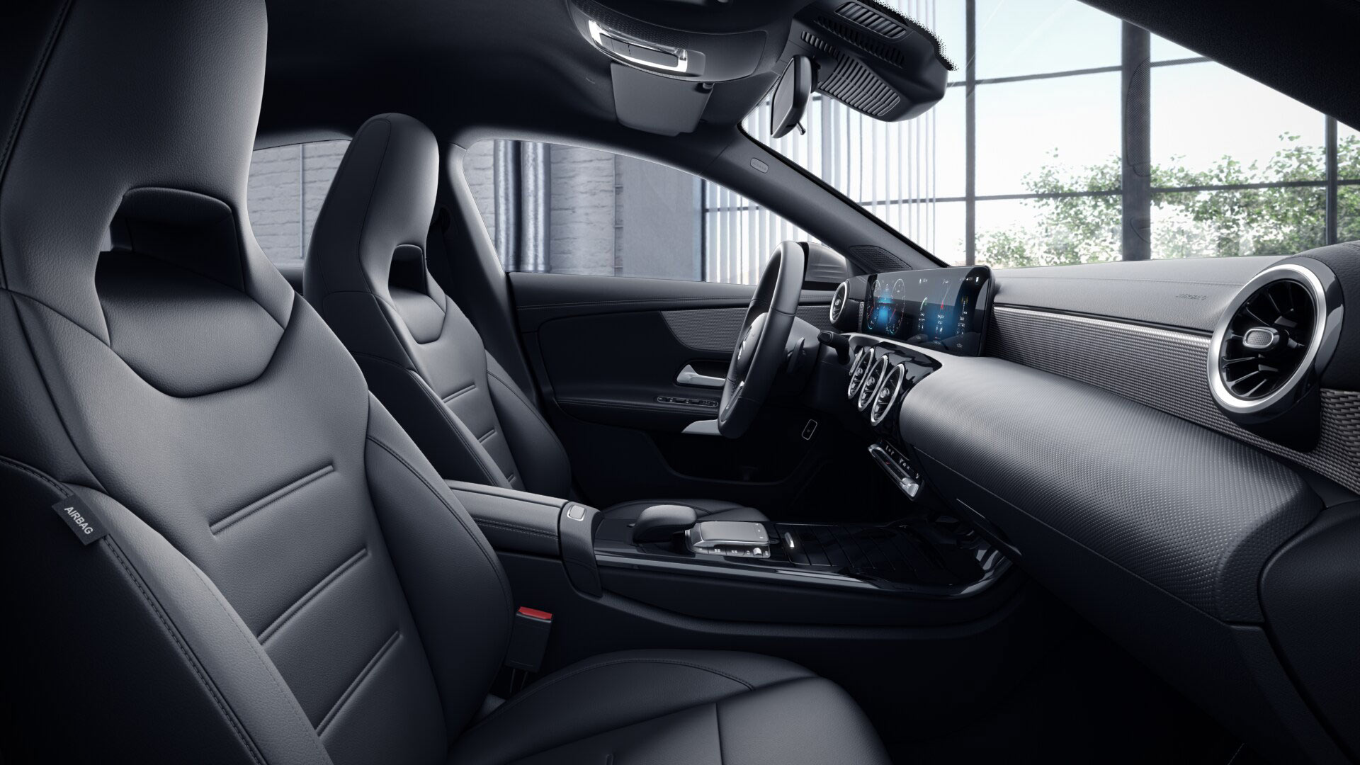 Poste de conduite de la Mercedes CLA Finition Style avec vue sur l’écran tactile, sellerie et la console centrale