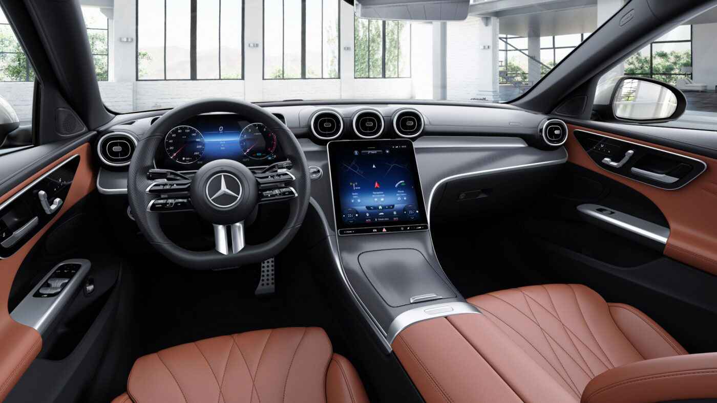 Poste de conduite de la Mercedes-Benz Classe C Berline AMG Line Plus avec vue sur l’écran tactile, sellerie et la console centrale